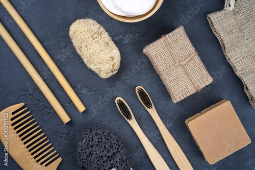Photos Various natural bath products and tools on gray concrete background