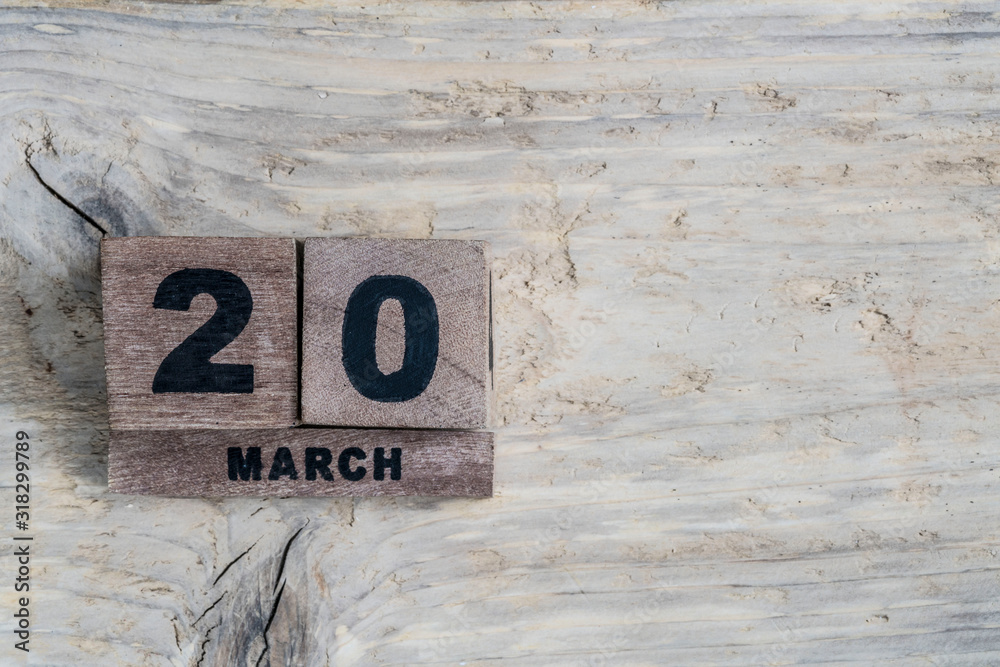cube calendar for march on wooden background with copy space cube calendar for march on wooden background with copy space