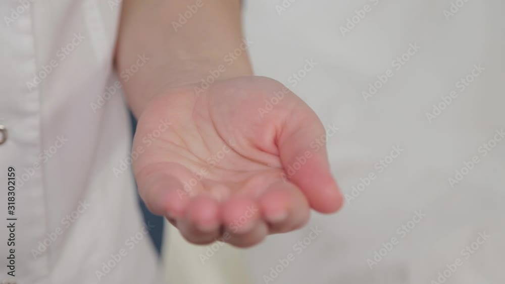 Woman massage therapist pours massage oil on hand. Woman massage therapist pours massage oil on hand.