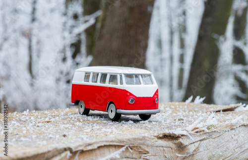 Classic van toy.  Red and white van in frozen nature.