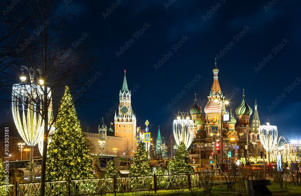 Saint Basil cathedral ( Temple of Basil the Blessed), Spasskaya Tower and Christmas (New Year) decoration, Moscow, Russia. View from Zaryadye Park