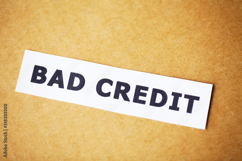 Bad credit, written on a white sheet of paper Bad credit, written on a white sheet of paper