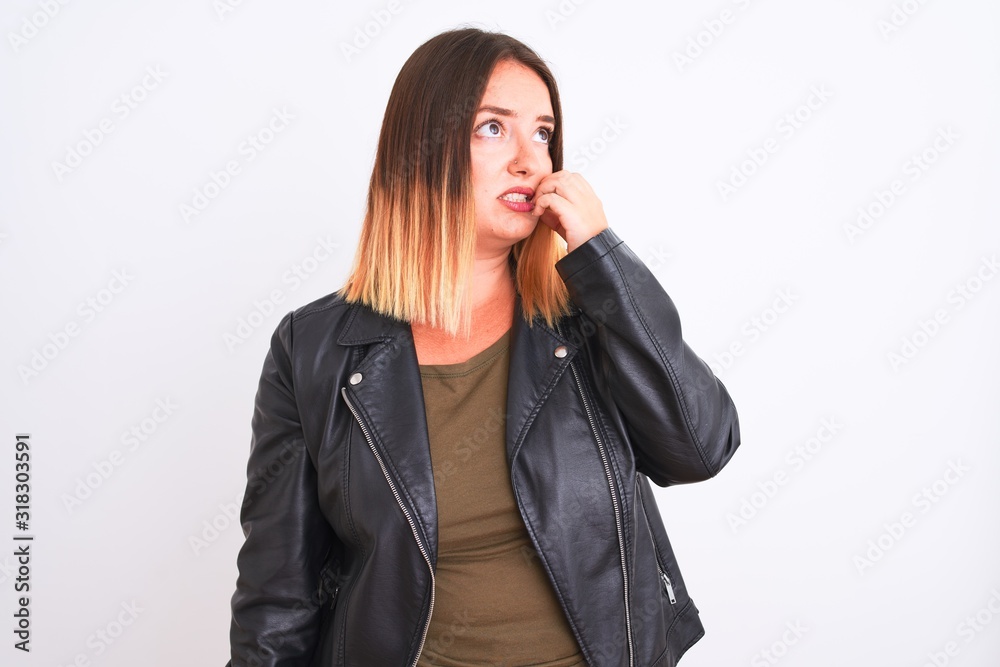 Young beautiful woman wearing t-shirt and jacket standing over isolated white background looking stressed and nervous with hands on mouth biting nails. Anxiety problem. Young beautiful woman wearing t-shirt and jacket standing over isolated white background looking stressed and nervous with hands on mouth biting nails. Anxiety problem.