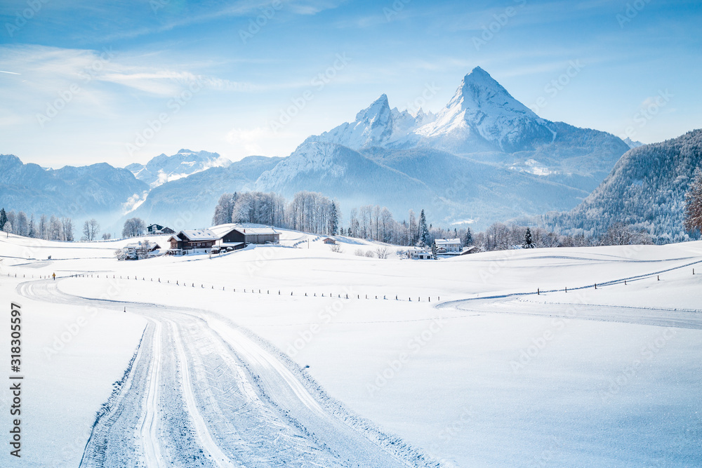 Winter wonderland scenery with trail in the Alps
