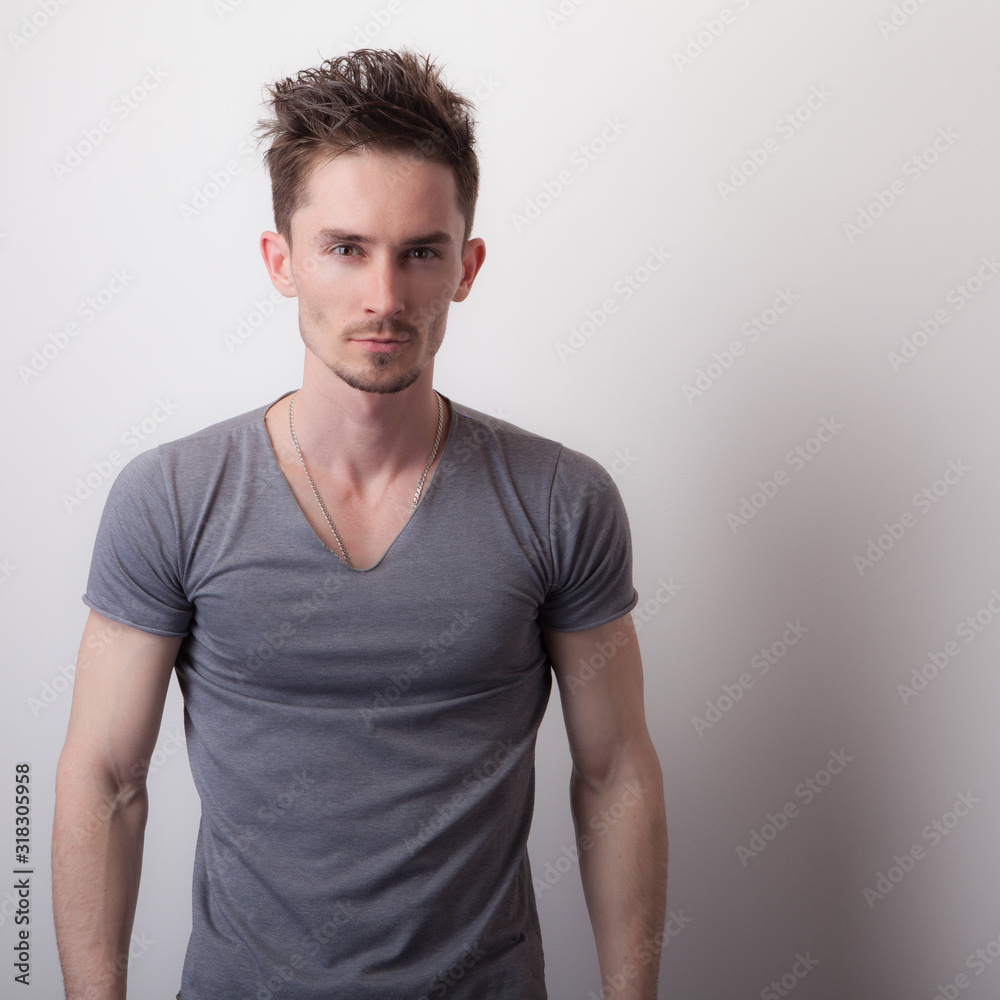 Handsome young elegant man studio portrait. Handsome young elegant man studio portrait.