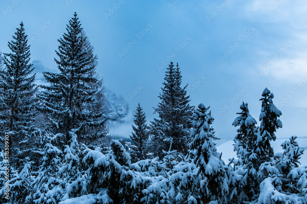 Stormy clouds in italian dolomites in a snowy winter Stormy clouds in italian dolomites in a snowy winter