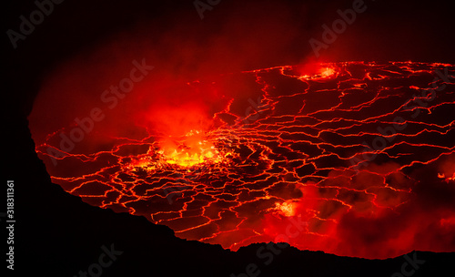 Crater of active lava lake Mount Nyiragongo,View from the summit at Volcanoes National Park in the Democratic Republic of Congo photo