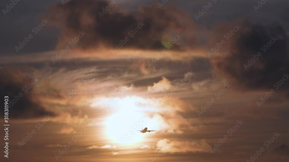 Travel, vacation, air transport, transportation concept. Jet is flying in sunset sky Travel, vacation, air transport, transportation concept. Jet is flying in sunset sky