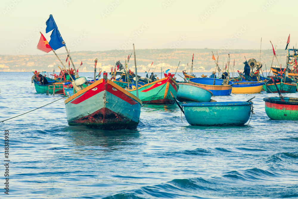 Fototapeta premium Traditinal Basket Boats on blue sea in Phan Thiet, Mui ne, Vietnam