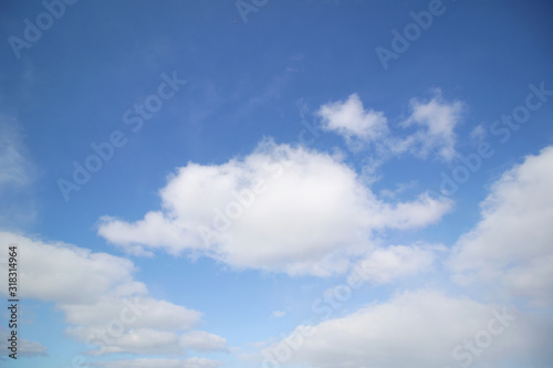 background of white fluffy cumulus clouds