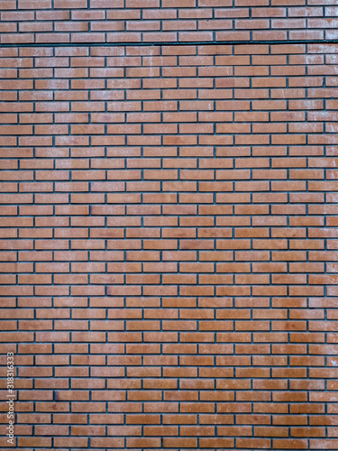 red brick wall with visible signs of wear and tear