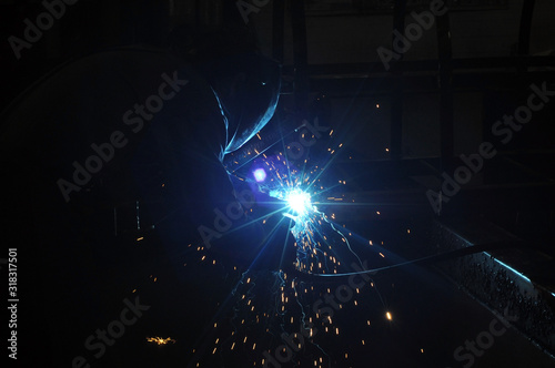 electric welder brews steel at the factory. © Александр Байдук
