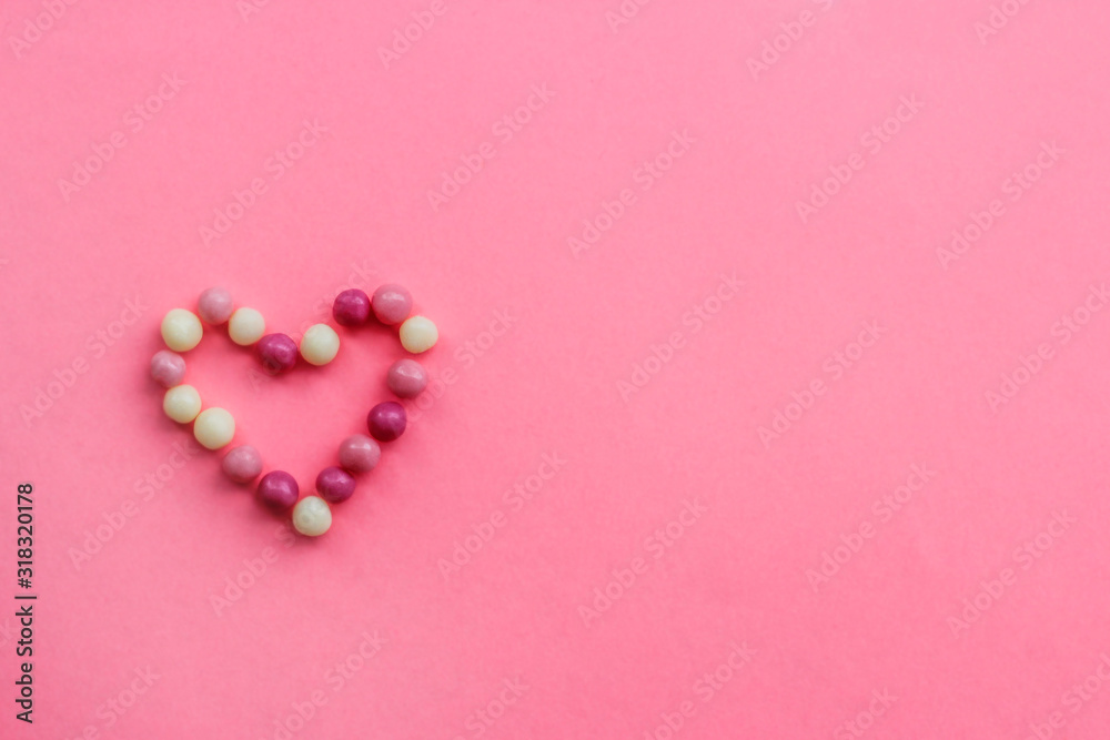heart of round pink and white candy balls. symbol of the heart