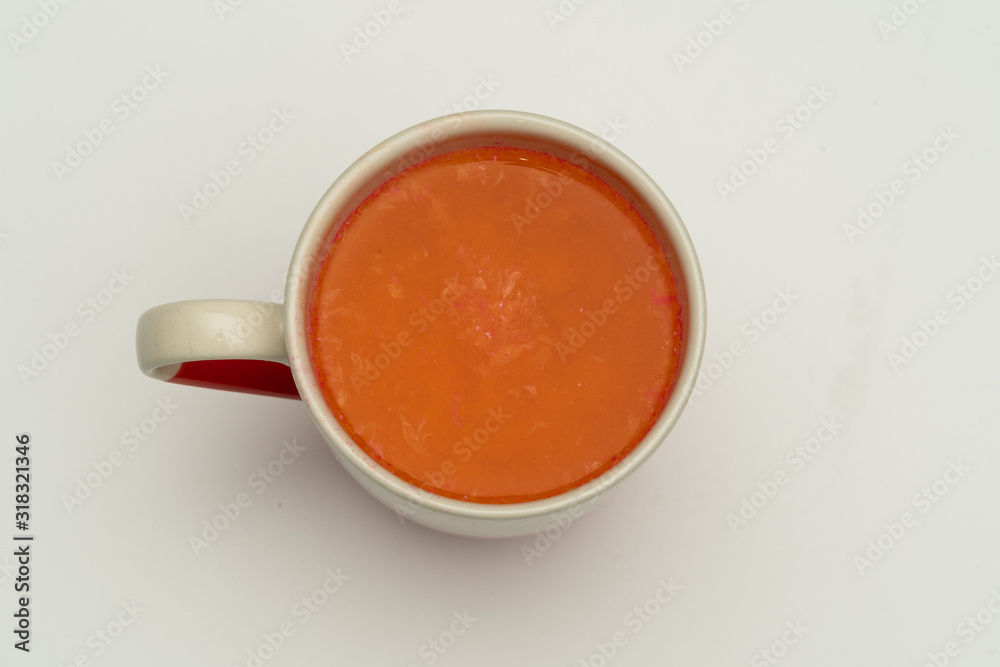 Glasses of carrot juice with vegetables on table close up