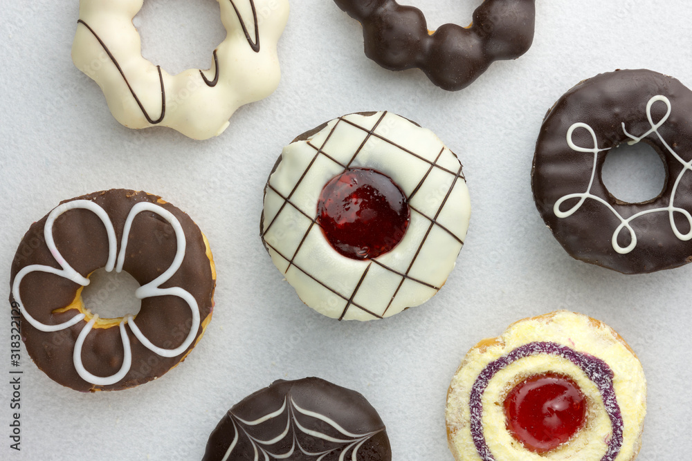Set of various colorful donuts isolated on white background. Top view.