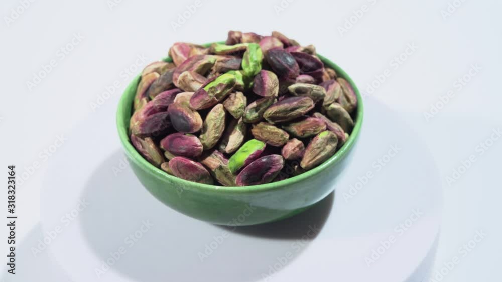 Rotation of emerald green pistachio nuts from Bronte, Sicily, Italy Rotation of emerald green pistachio nuts from Bronte, Sicily, Italy
