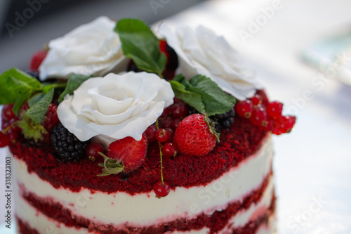 Red velvet cake with close up with white roses