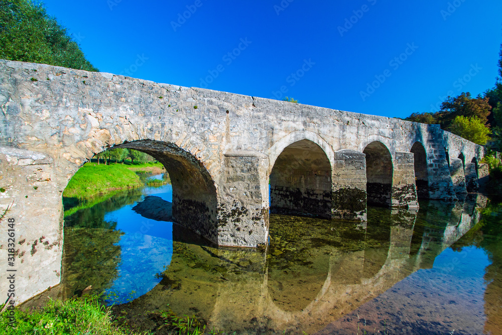 Old stone bridge on the river Dobra in Karlovac county, Croatia