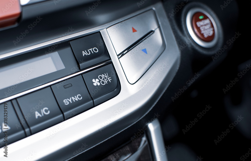 Air conditioner button for on/off speed air flow and automatic temperature button in a luxury car. Air conditioner button for on/off speed air flow and automatic temperature button in a luxury car.