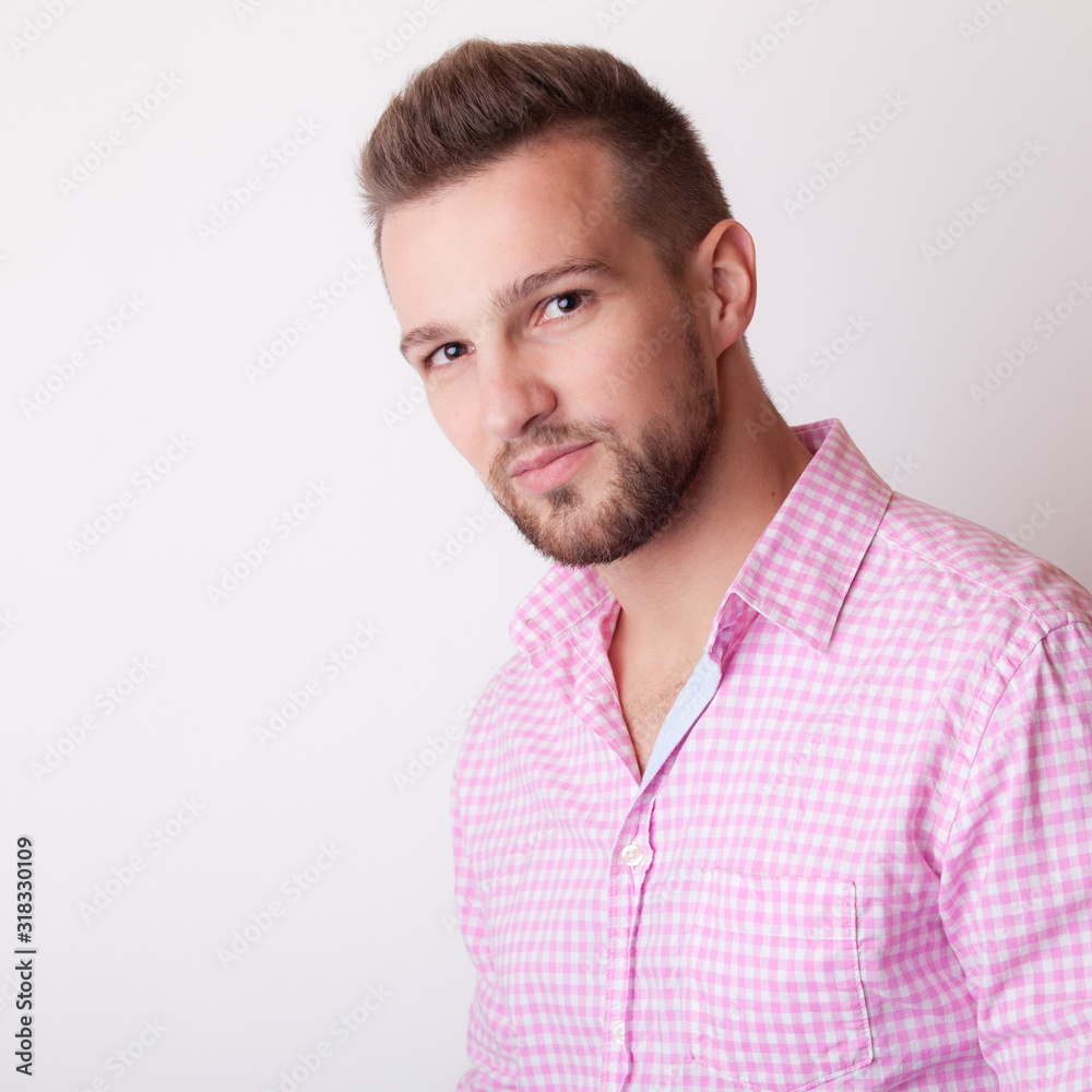 Handsome young elegant man studio portrait.