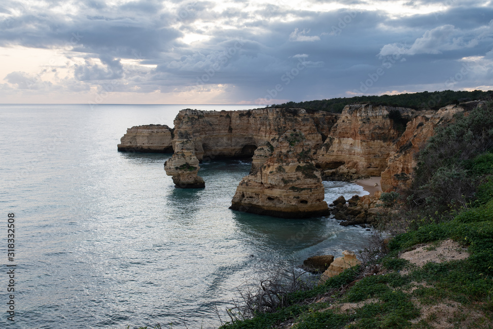 Scenic evening view of Praia (English Beach) da Marinha and the nearby cliffs and the Atlantic Ocean near Lagos in the Algarve in Portugal.