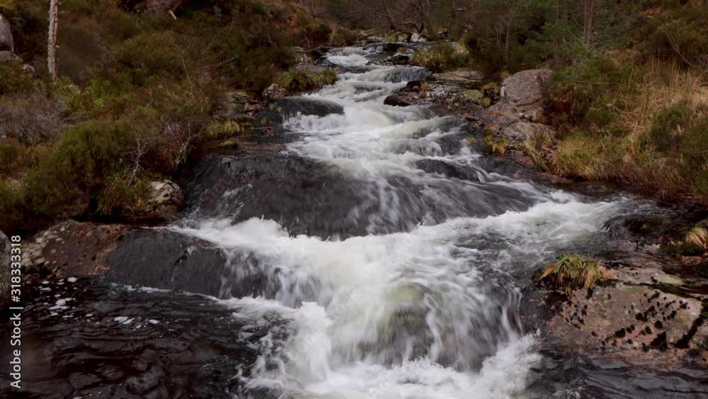 hidden scenic beautiful waterfall within cairngorms national park, Scotland, during a mild winters day in January hidden scenic beautiful waterfall within cairngorms national park, Scotland, during a mild winters day in January