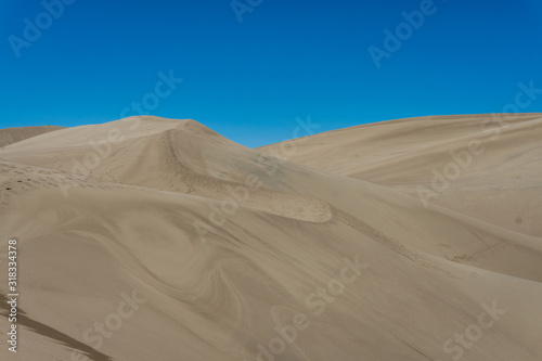 Giant sand dune landscape with clear blue sky