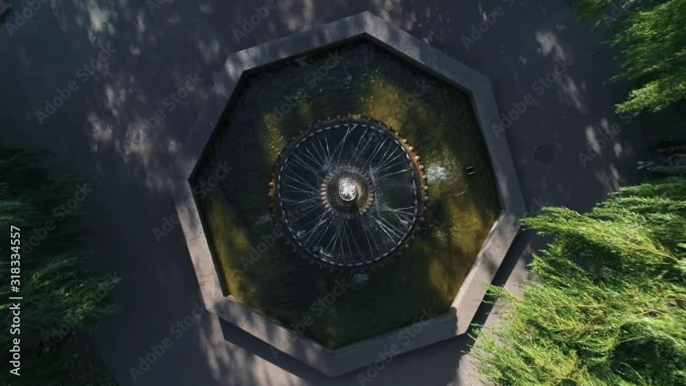 Aerial view of round fountain in city garden. 4K Aerial view of round fountain in city garden. 4K