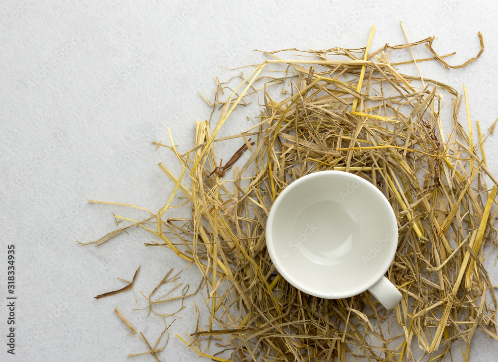 Coffee cup on a straw isolated on a white background.