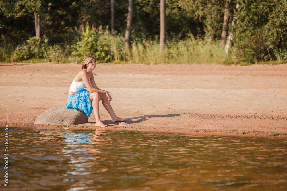 Woman enjoys on beach. Girl jumps on waves and laughs. Model in swimsuit on ocean vacation. Tourism and rest Woman enjoys on beach. Girl jumps on waves and laughs. Model in swimsuit on ocean vacation. Tourism and rest