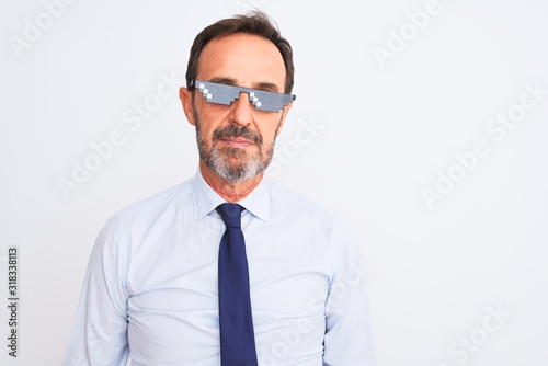 Middle age businessman wearing thug life sunglasses over isolated white background with serious expression on face. Simple and natural looking at the camera.
