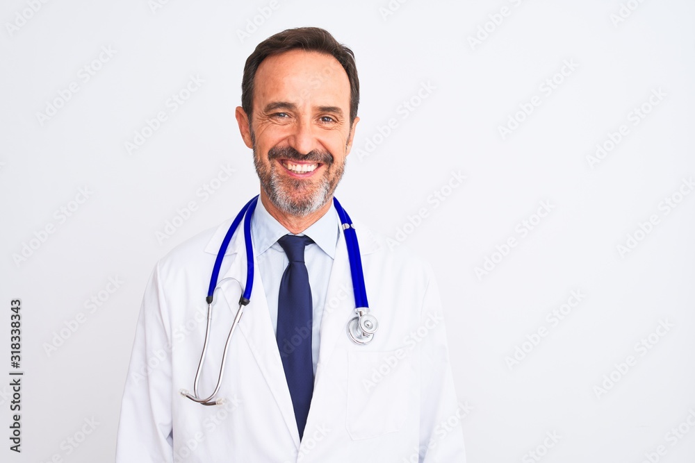 Middle age doctor man wearing coat and stethoscope standing over isolated white background with a happy and cool smile on face. Lucky person.
