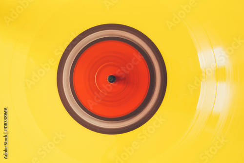 Close up of turntable playing yellow vinyl record
