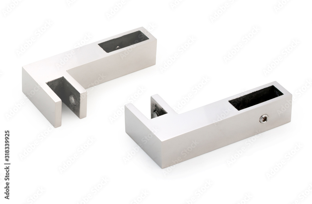 Pair of chrome corner holders for glass door or wall in bathroom, shower enclosure, showcase, glass fitting isolated on a white, closeup. Pair of chrome corner holders for glass door or wall in bathroom, shower enclosure, showcase, glass fitting isolated on a white, closeup.