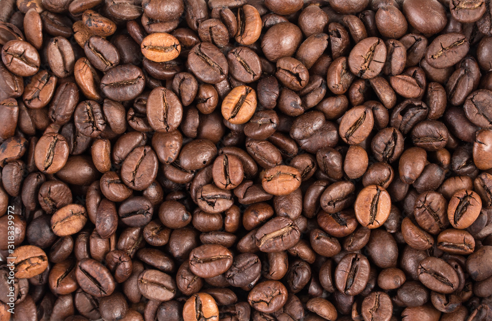 Obraz premium Beans of coffee background top view