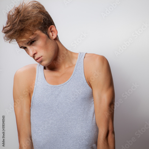 Handsome young elegant man studio portrait.