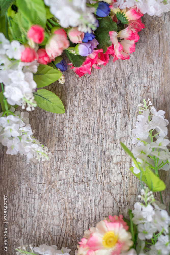 Spring and summer background.Flowers on a wooden texture. Space for text Spring and summer background.Flowers on a wooden texture. Space for text
