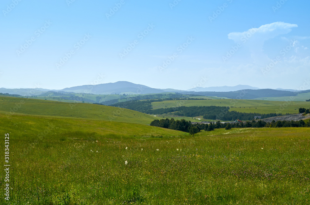 Idyllic Serbian mountain landscape - with hills, pastures, fields and valleys - in spring
