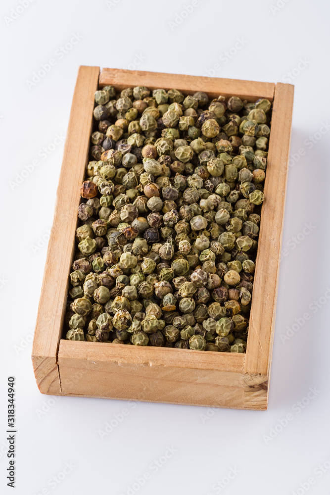 green peppers in wooden box on white background green peppers in wooden box on white background
