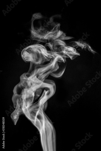 Smoke or steam on black isolated background for insertion image in overlay mode_