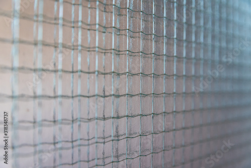 Type of glass. Metal mesh in the glass.