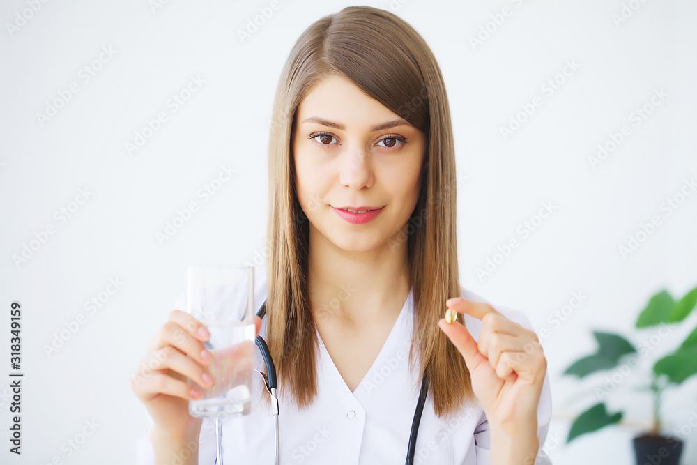 Portrait of young doctor standing in medical office Portrait of young doctor standing in medical office