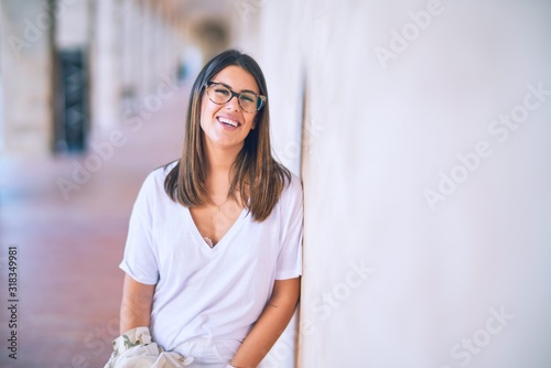 Free Download Young beautiful woman smiling happy and confident. Standing with smile on face at the town street - GFXLoad