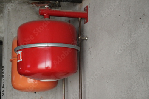 Oil boiler red balloon installation in the garage