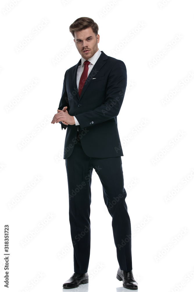 elegant young businessman in suit rubbing palms elegant young businessman in suit rubbing palms