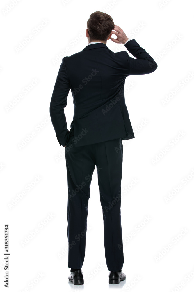 elegant businessman in suit scratching head and thinking elegant businessman in suit scratching head and thinking