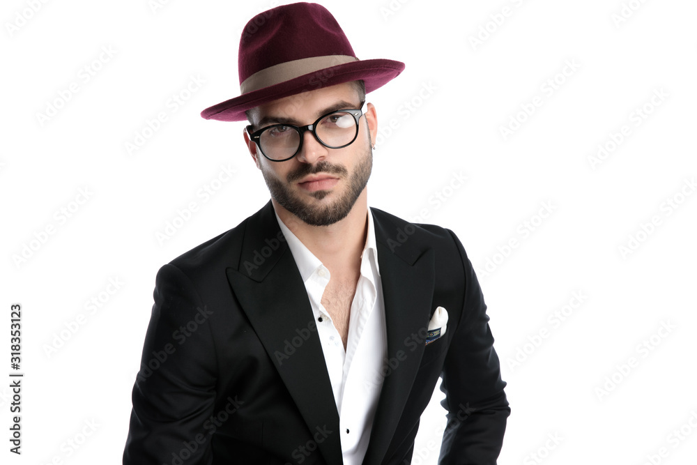 formal business man with burgundy hat staring at camera formal business man with burgundy hat staring at camera