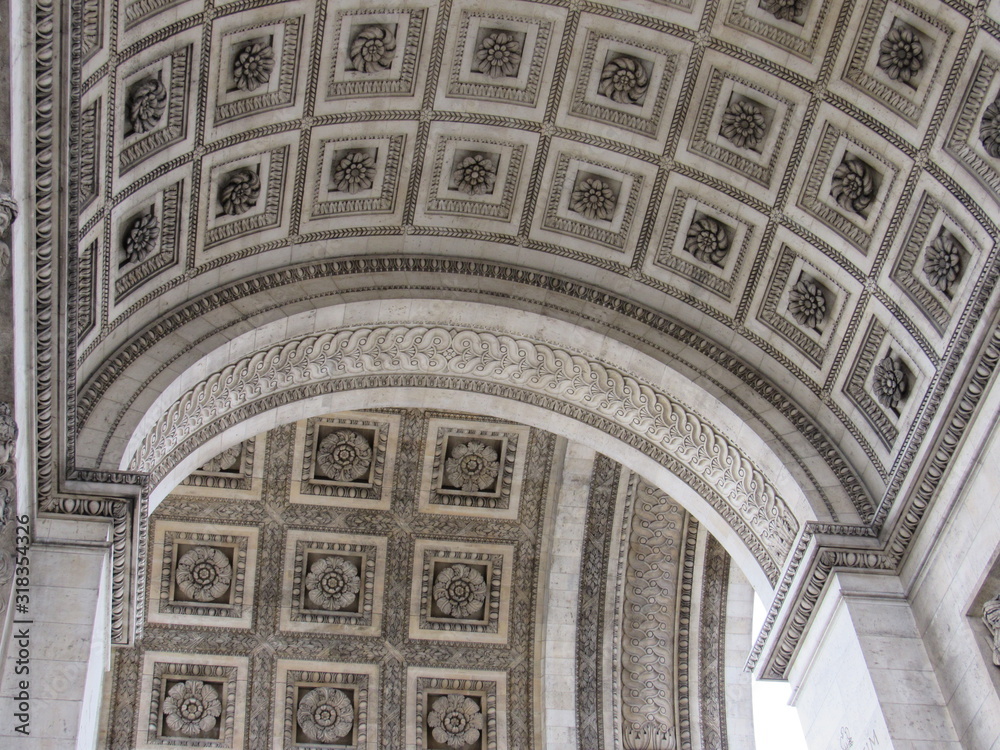 Obraz premium View of the ceiling design of the Arc de Triomphe located in Paris, France 