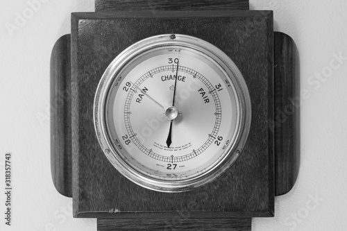 Close up of an antique barometer indicating high pressure photo