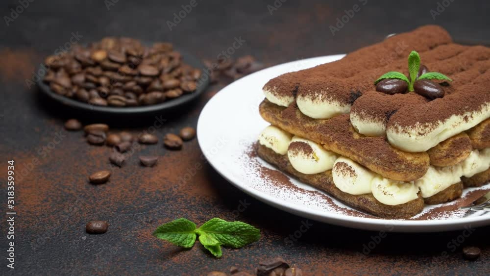 Classic tiramisu dessert on ceramic plate on concrete background Classic tiramisu dessert on ceramic plate on concrete background